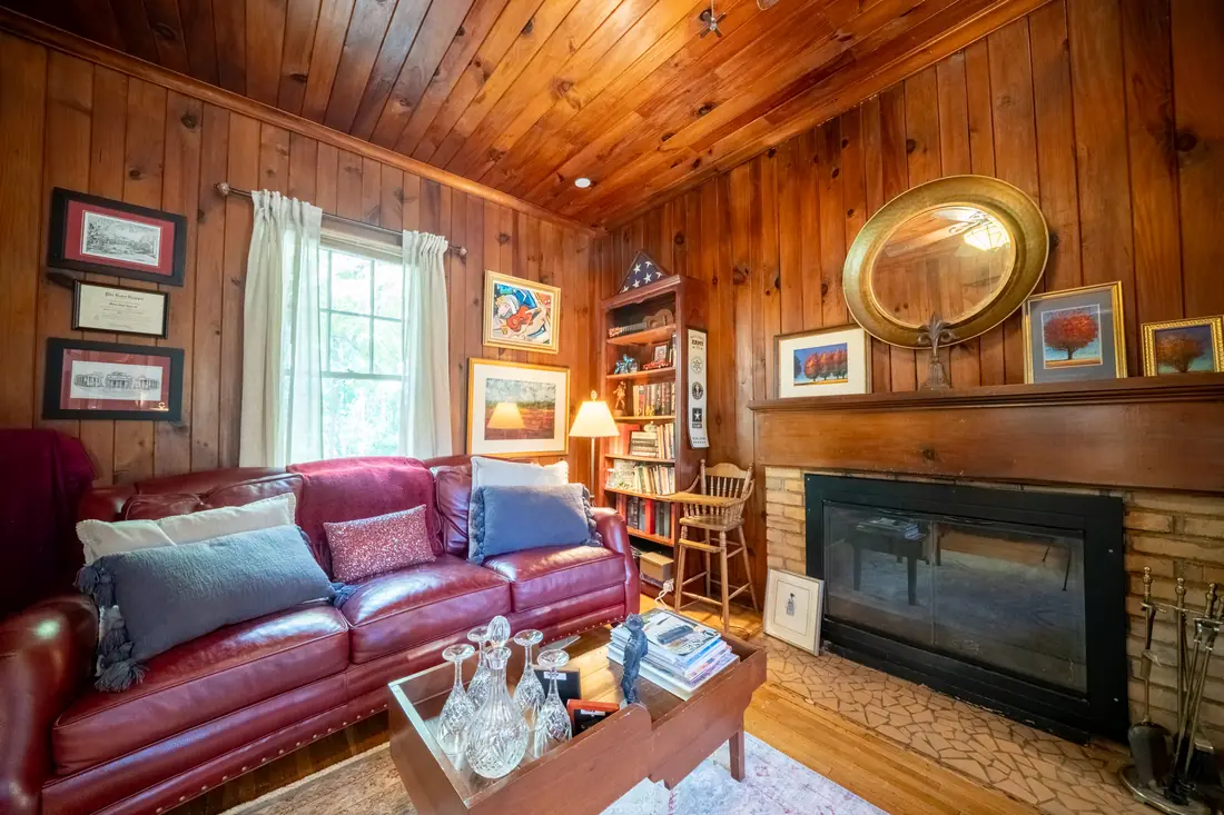 Wood-paneled den with gas fireplace